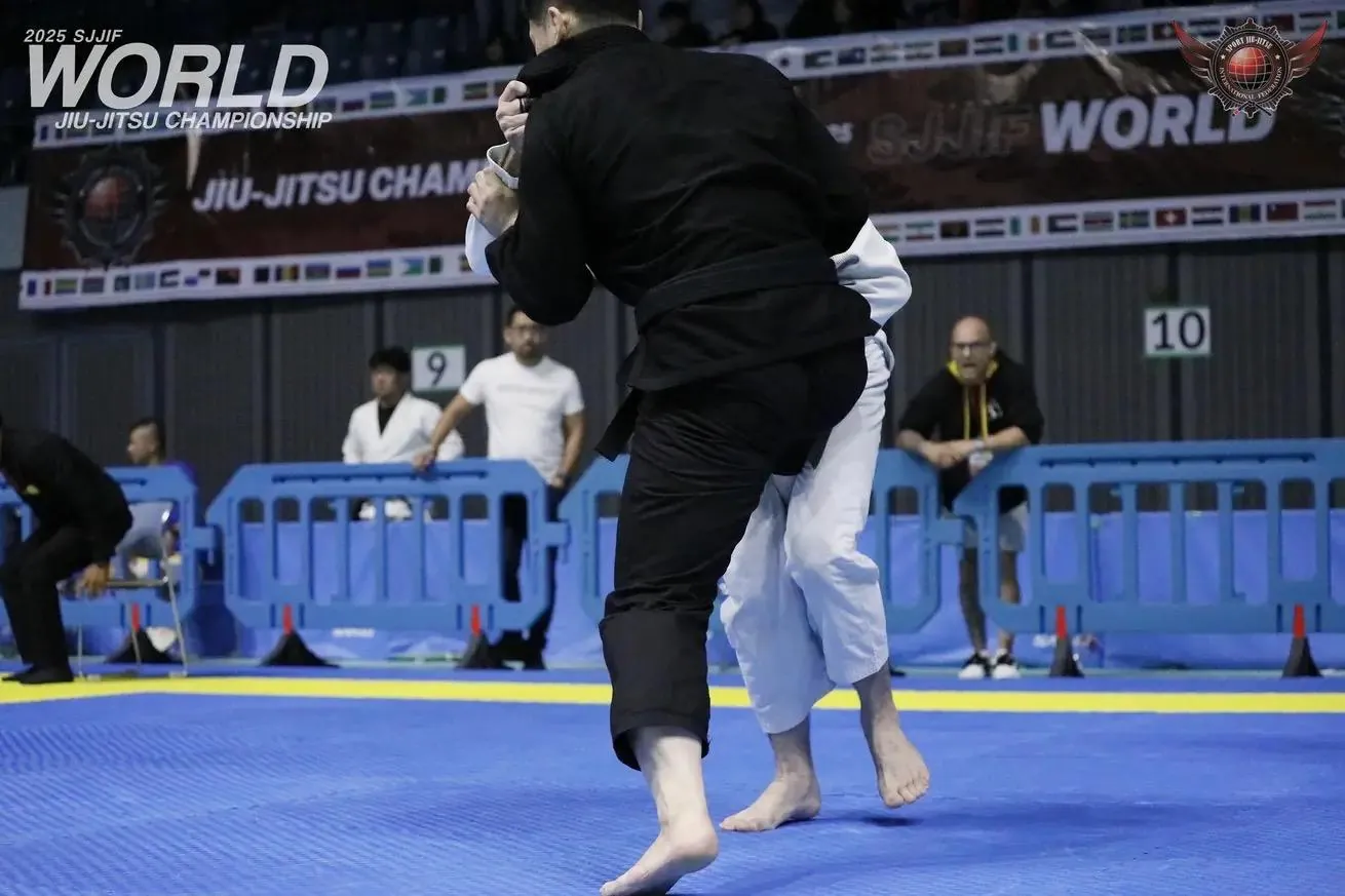 Two competitors fighting for grips on their feet at the 2025 SJJIF World Jiu-Jitsu Championship